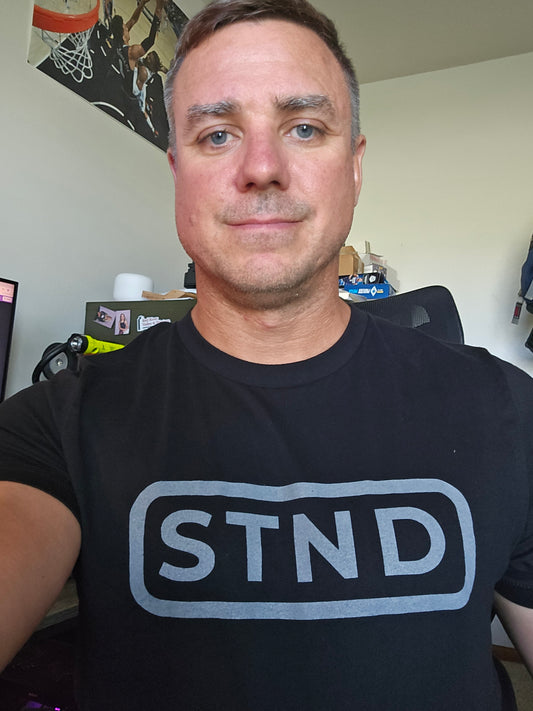 STND Classic Tee (Large Front STND) –  “Built to outlast every struggle.”